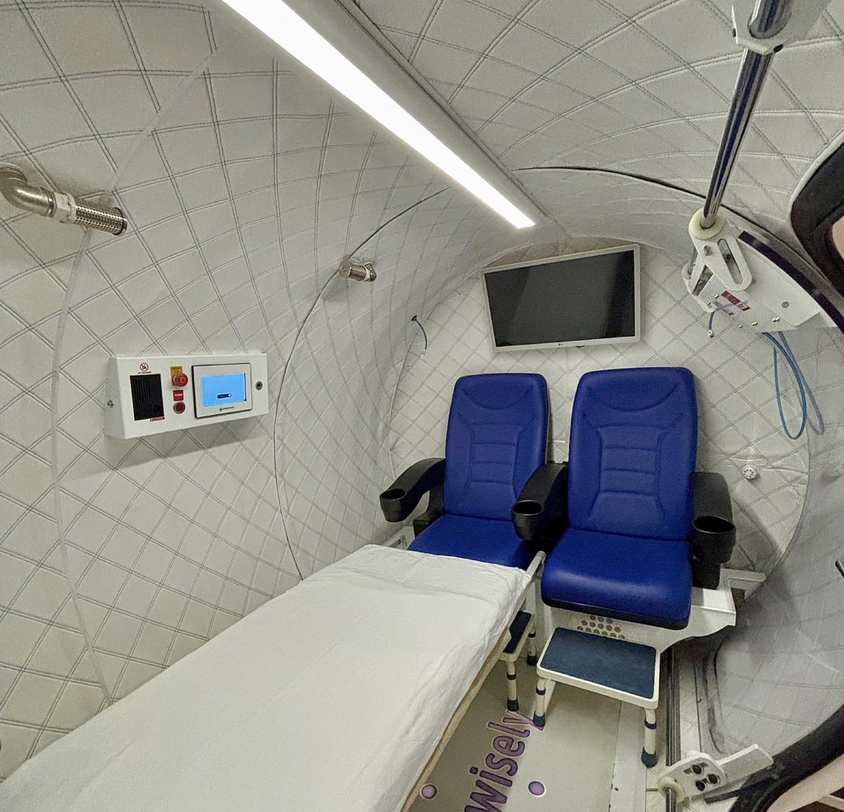 Medical-grade HBOT chamber interior with patient monitoring
